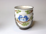 Powder-glazed teacup with an owl design